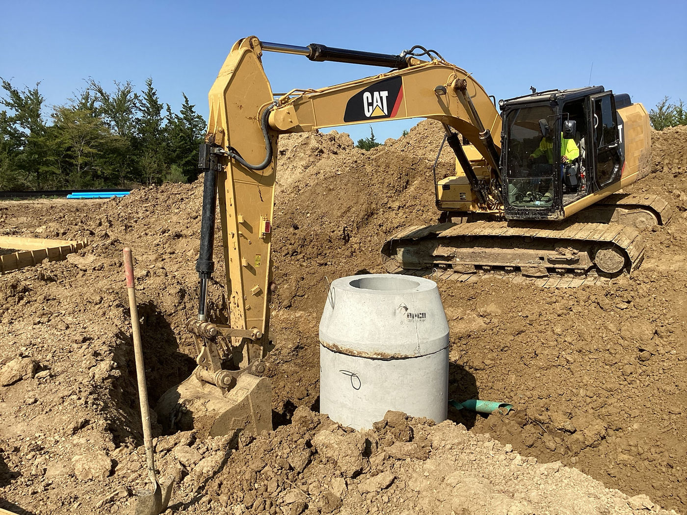 Excavator near utility structure