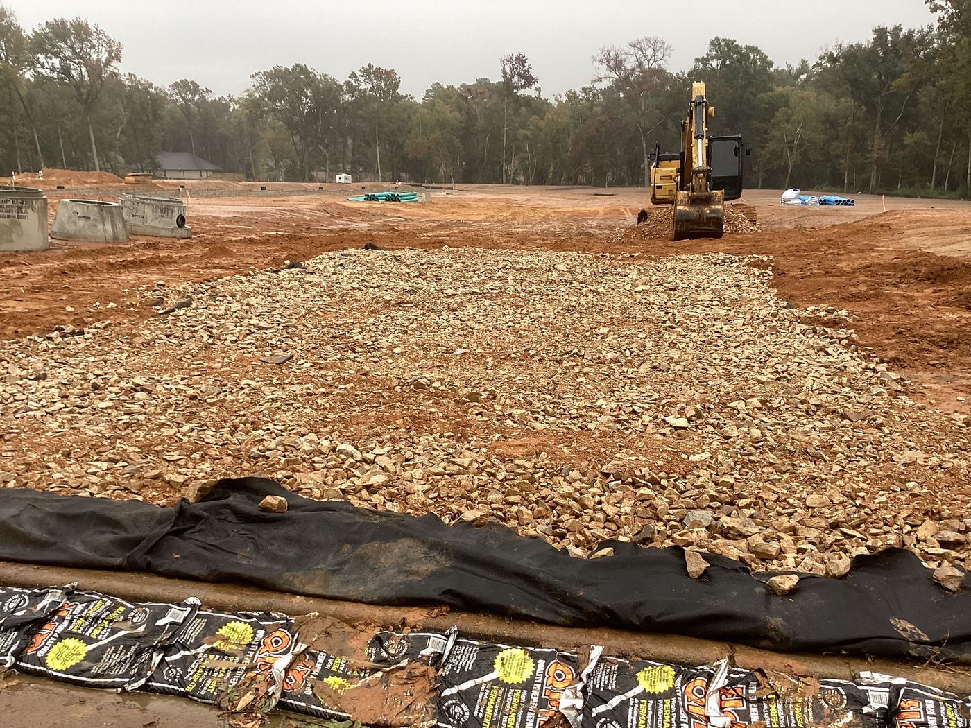 Utility pipe installation on active jobsite