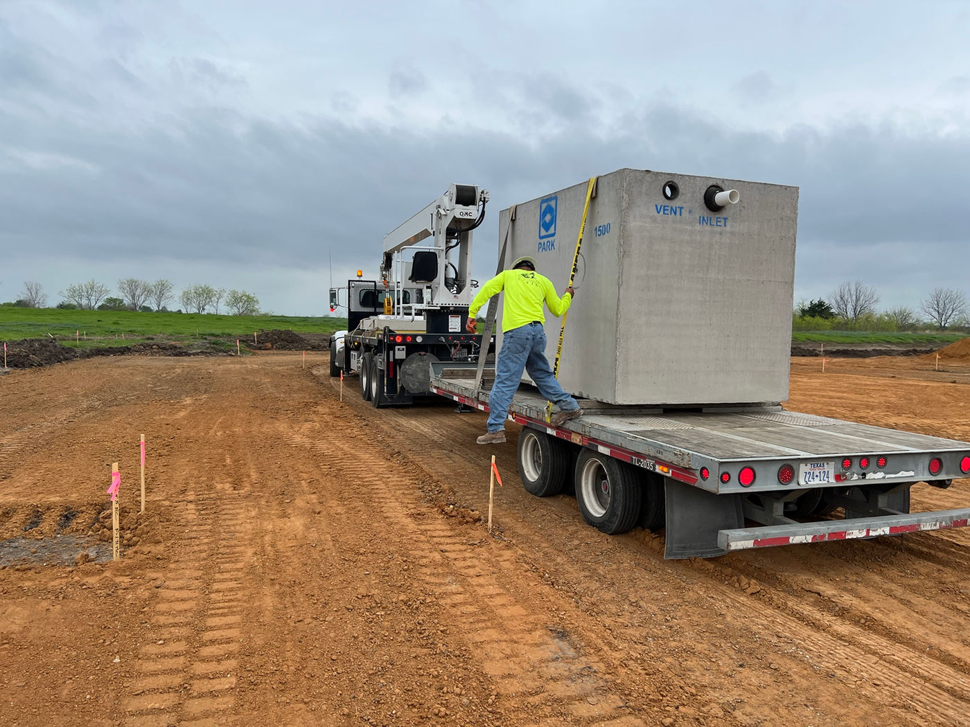 Precast structure on flatbed trailer