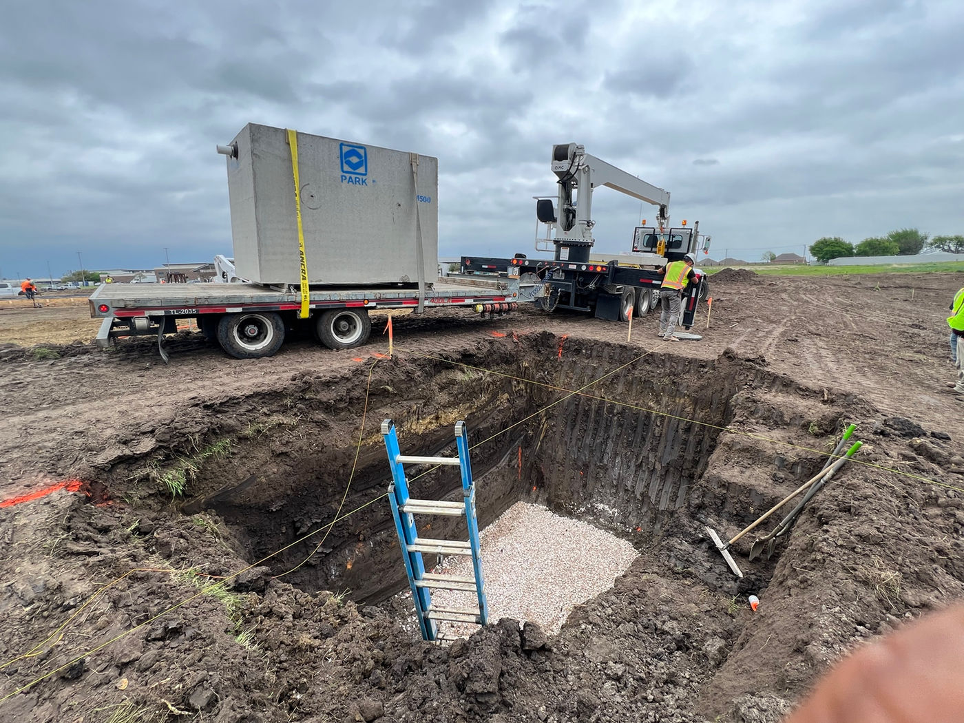 Excavated pit and structure delivery staging