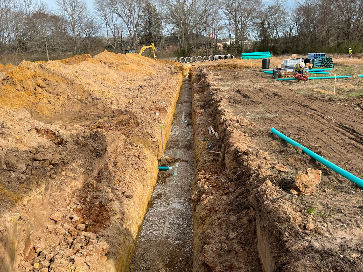 Long trench with utility pipe installation